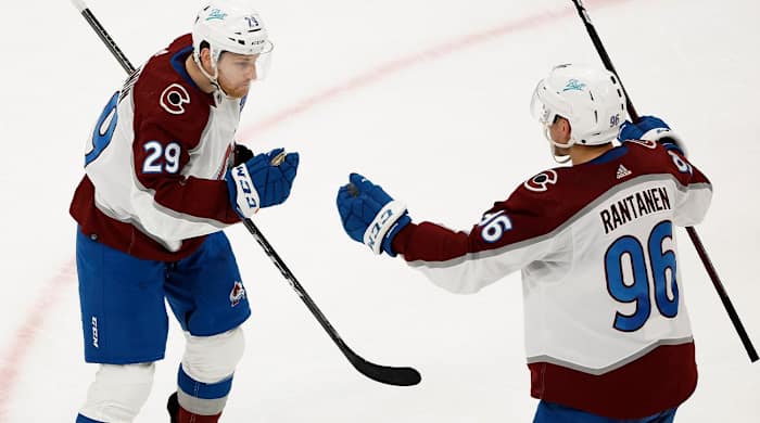 Colorado Avalanche's Nathan MacKinnon (29) is congratulated by Mikko Rantanen after scoring against the Boston Bruins during the second period of an NHL hockey game Monday, Feb. 21, 2022, in Boston.